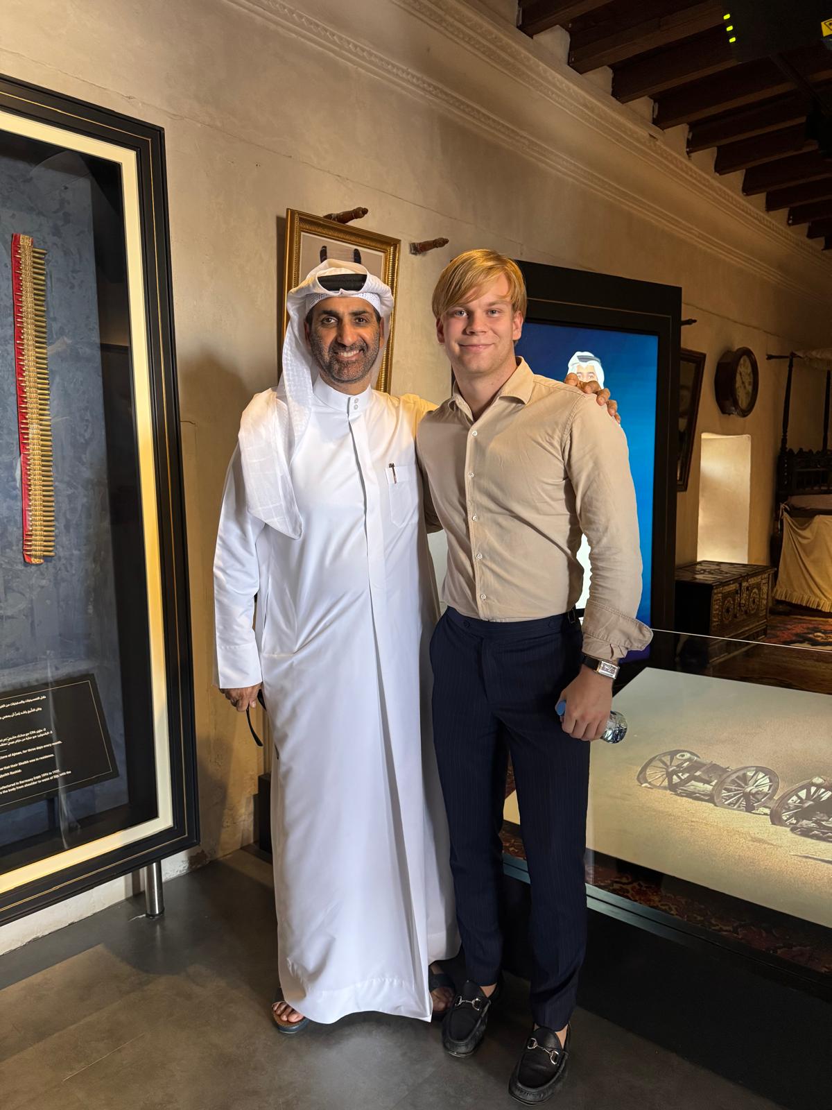 An Emirati host and a Finnish participant in a heritage museum in Ajman