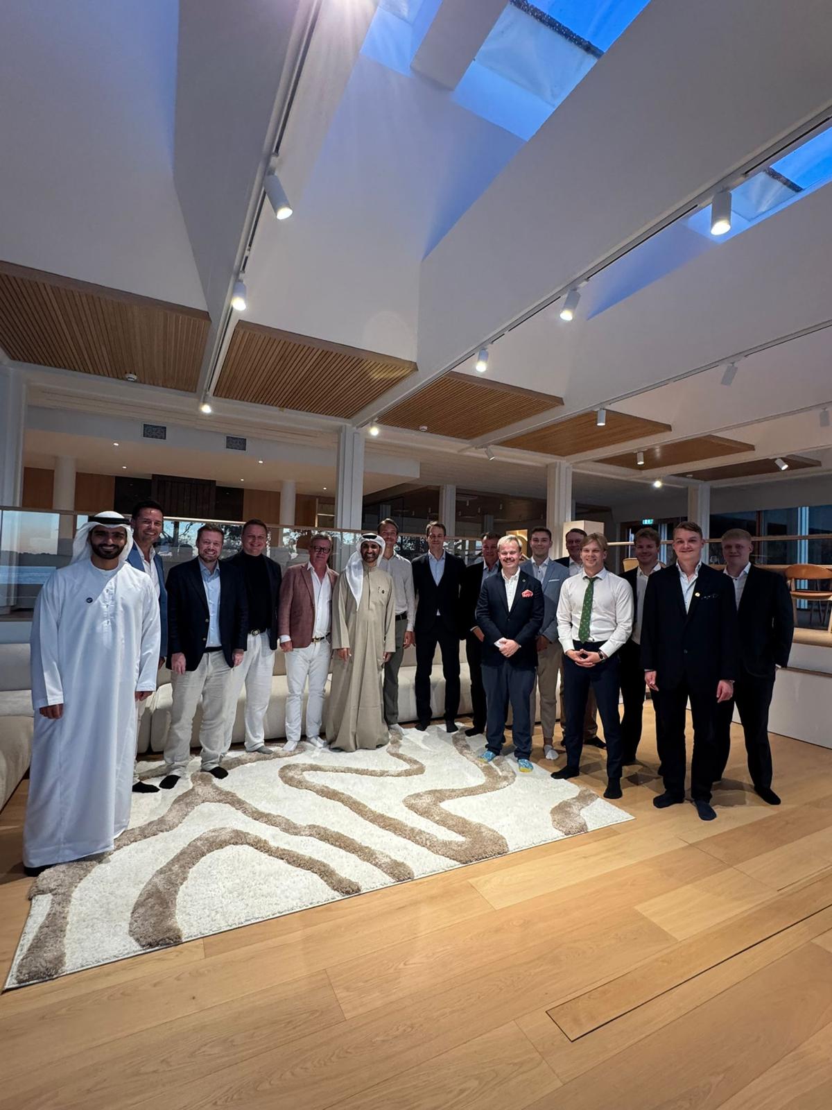 Founding members and guests gathered in a Finnish lakeside house